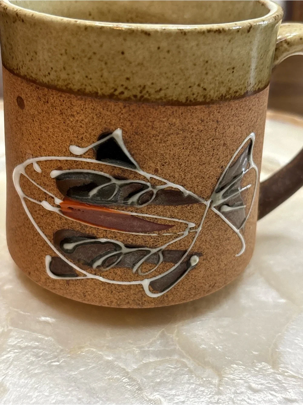 Three vintage stoneware pottery mugs with hand painted fish